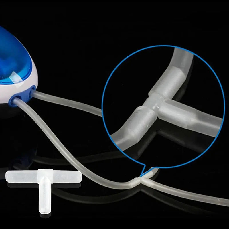 Close-up of a blue light-emitting device with clear tubing on a black background