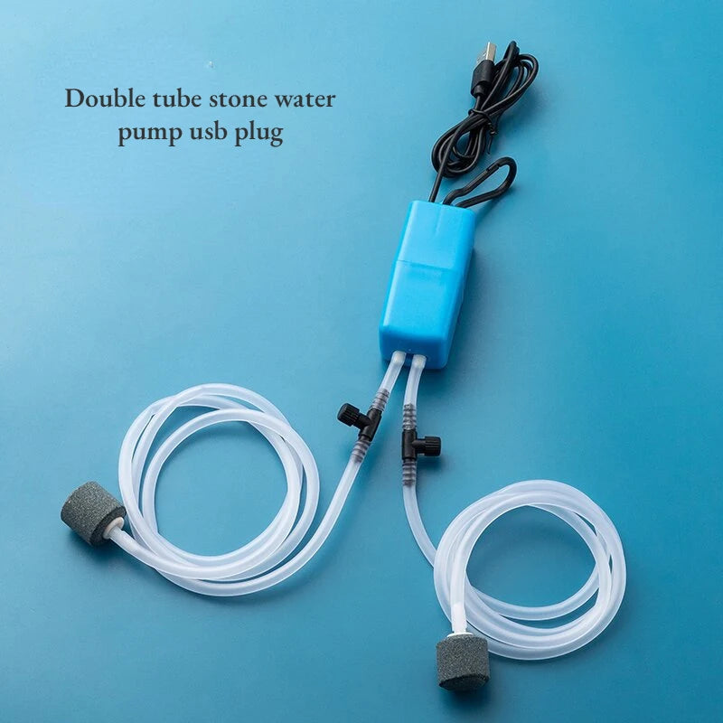 Double tube stone water pump with USB plug on a blue background