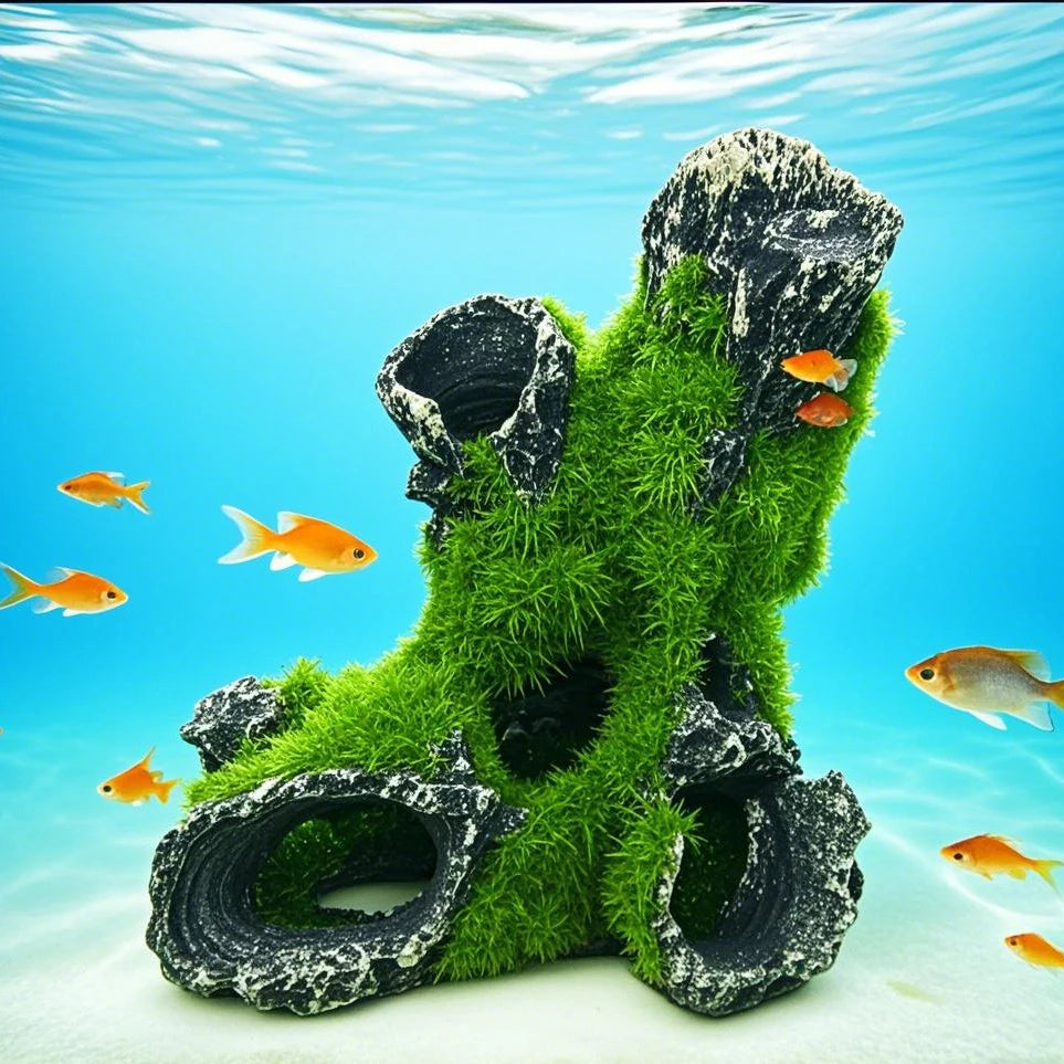 Decorative aquarium rock with green moss and goldfish swimming around