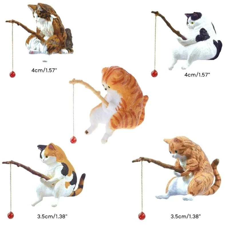 Set of miniature cat figurines with various poses on a white background