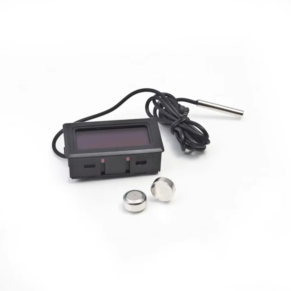 Digital temperature meter with probe and sensor on a white background