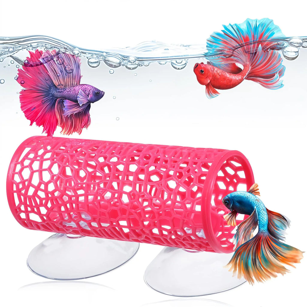 Pink plastic tube with cutout design in an aquarium with colorful betta fish.