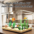 Clear fish tank with goldfish and plants on a wooden surface, text 'High-definition PET non-toxic and harmless' above.