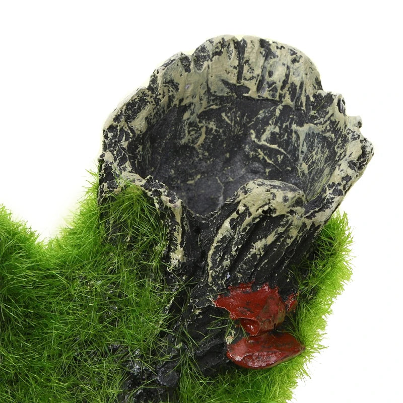 Decorative rock with a red base on a grassy background