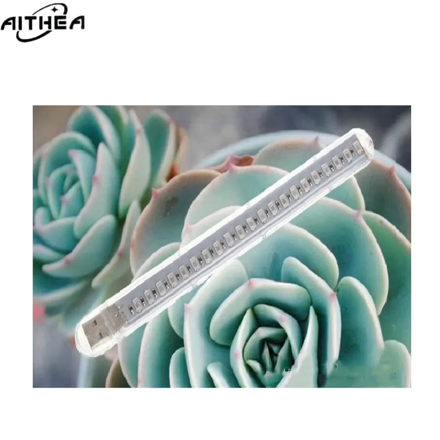 AITHEA aquatic plant LED grow light bar close-up showing red and blue LED diodes against green succulent leaves