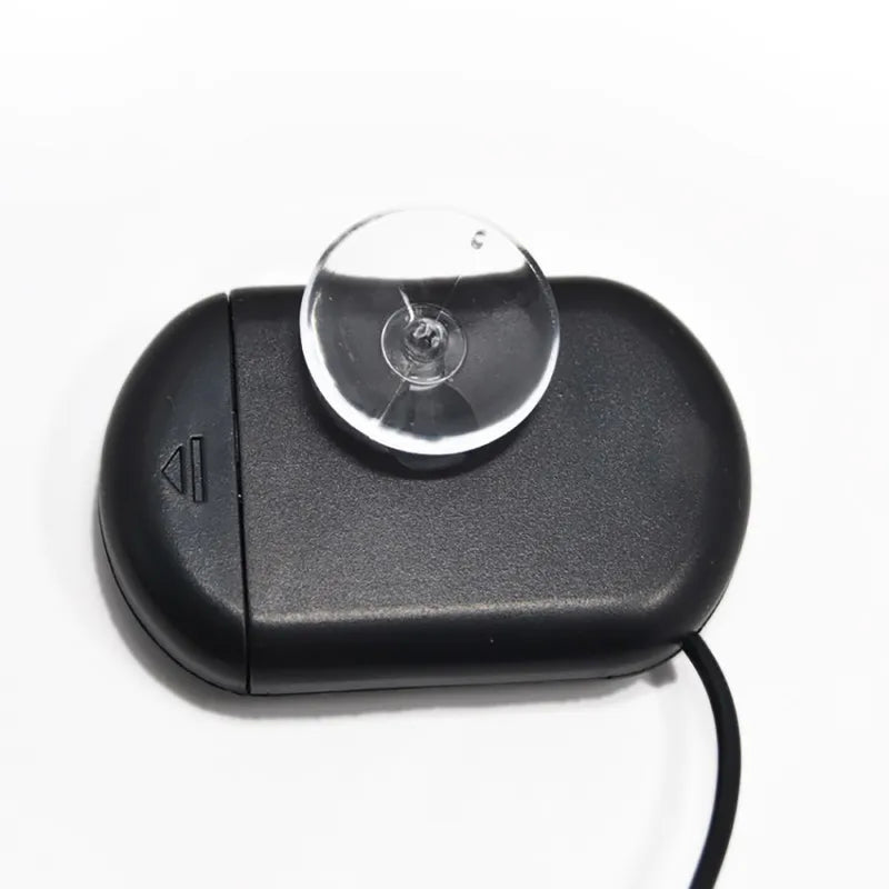 Black electronic device with a suction cup on a white background