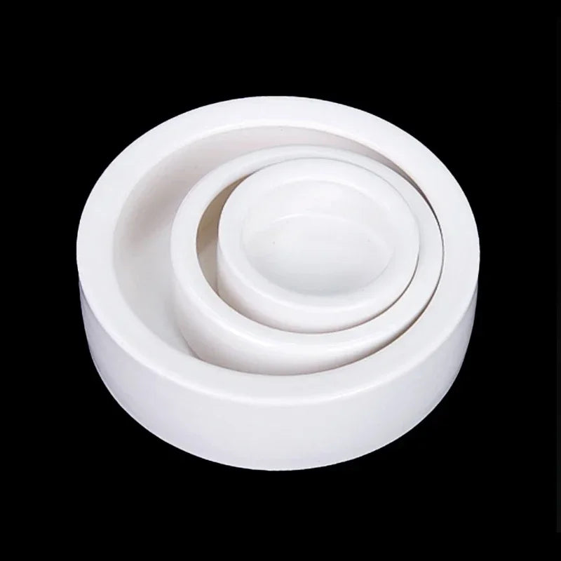 Set of white ceramic bearings on a black background