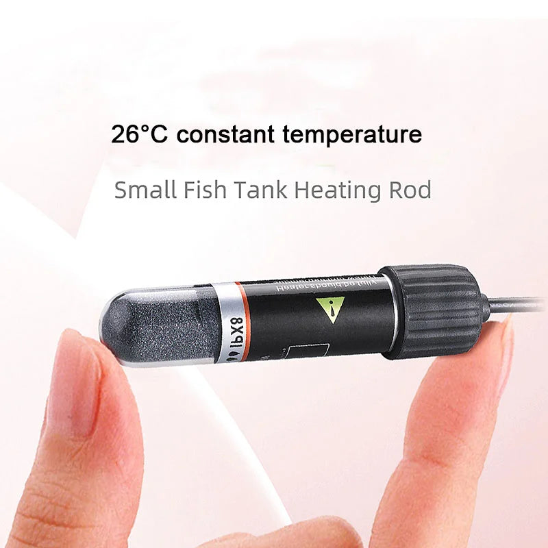 Small fish tank heating rod held between fingers with text indicating 26°C constant temperature.