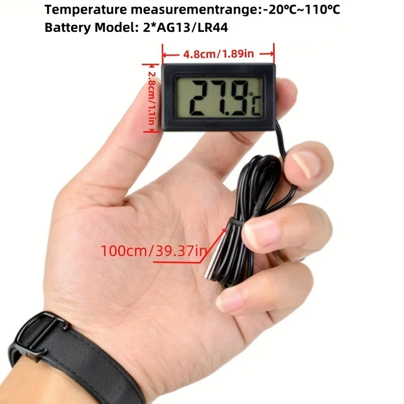 Digital thermometer held in a hand with measurement details on a white background