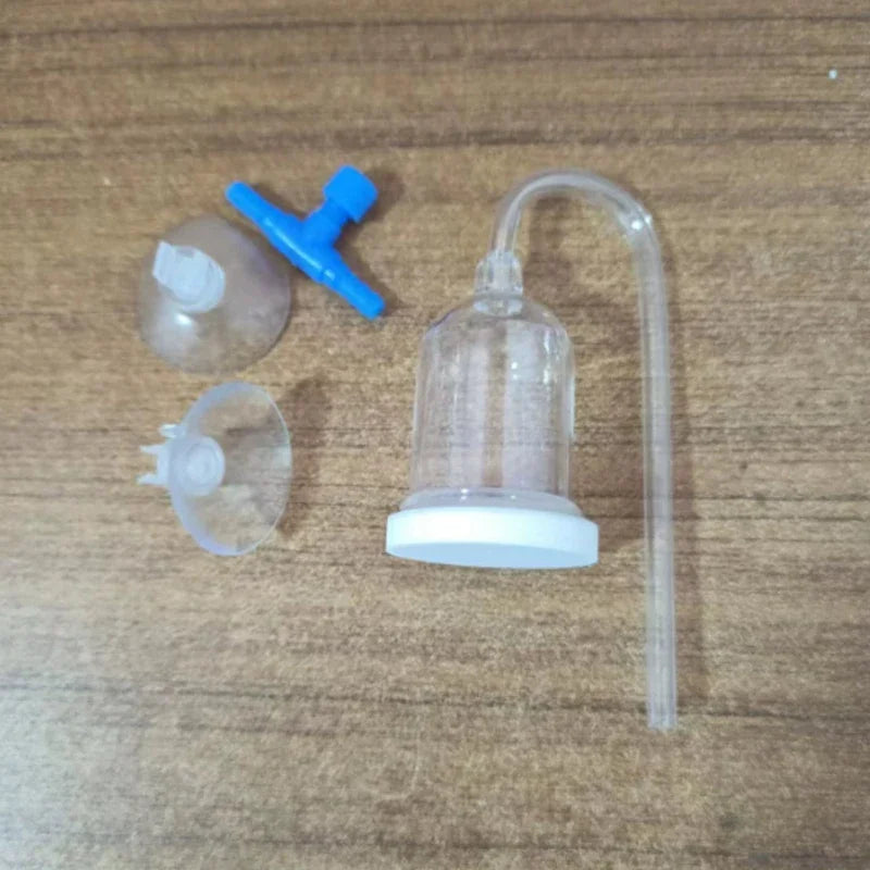 Clear plastic device with a hose on a wooden surface