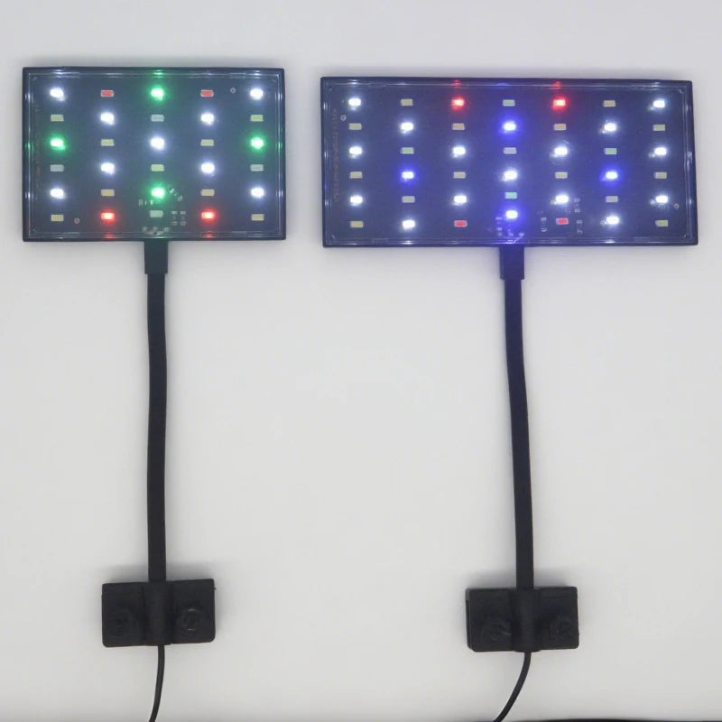 Two rectangular LED light panels mounted on a white wall, one emitting green and white light and the other emitting blue, white, and red light, both with black power cords and wall mounts.