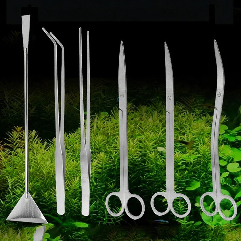 Set of metal tools on a grassy background