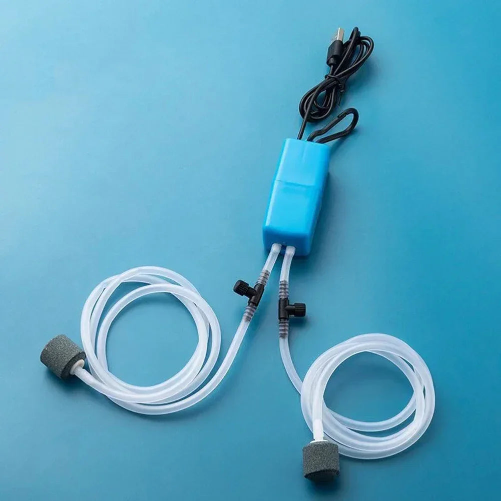 Aquarium pump with hoses on a blue background