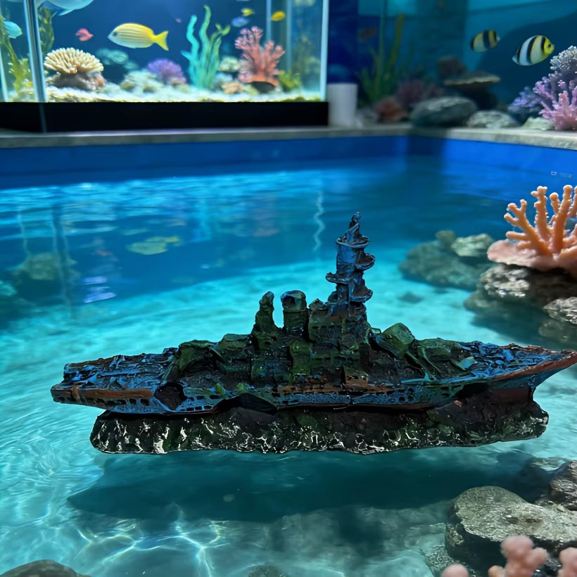 Decorative ship model in an aquarium with fish and coral